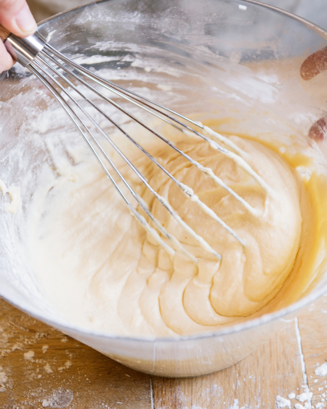 Person whisking a cake batter